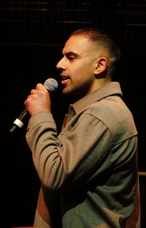 Dr. Kurren Sandhu speaking on stage