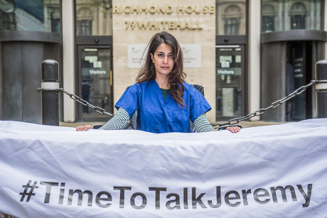 Dr Nadia Masood in scrubs outside Richmond House in Whitehall during the Justice for Health protest