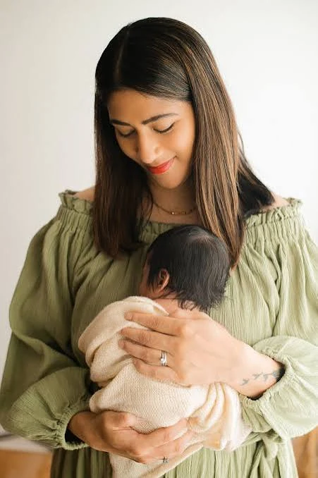 Seetal Savla holding her newborn daughter